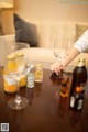 A person holding a wine glass on a table.